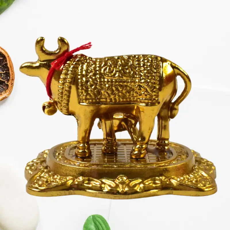 Metal golden kamdhenu cow with calf showpiece essential idol|idols - USB Powered